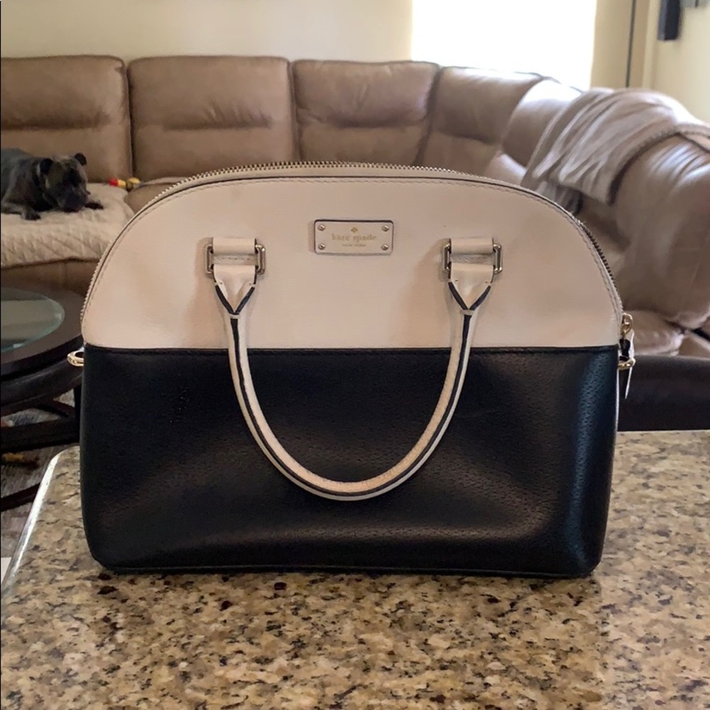 Black and whitish cream colored Kate Spade purse